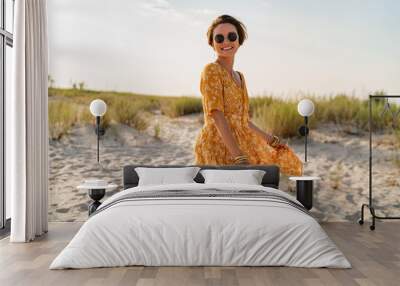 stylish attractive slim smiling woman on beach in summer style fashion trend outfit Wall mural