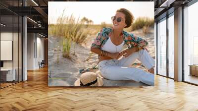 stylish attractive slim smiling woman on beach in summer style fashion trend outfit Wall mural