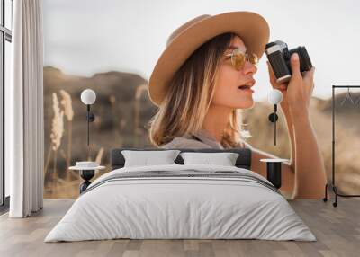 woman in desert walking on safari Wall mural