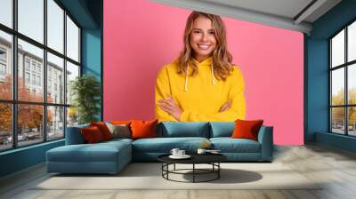 young pretty blonde woman cute face expression posing in yellow hoodie Wall mural