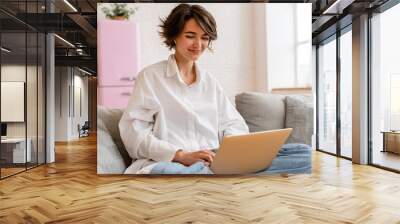 young pretty woman working online freelancer, remote job Wall mural