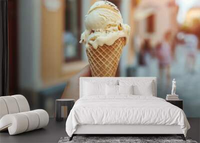 Female hand holding an ice cream cone, social media style photo, food, and travel destination concept  Wall mural