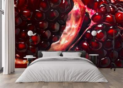 Delicious beautiful pomegranate on dark background. Close-up image of a red pomegranate Wall mural