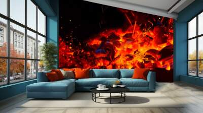 Hot wooden coals in the dark. Grill with hot coals and beautiful magic sparks with blue flame Wall mural