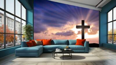 Jesus Christ cross on an amazing mountain sunset background with dramatic lighting and sunbeams. Easter, resurrection concept. Christian wooden cross Wall mural