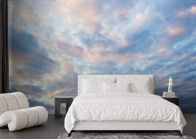 golden blue light clouds like waves in the sunset sky. vanilla sky. tranquil skyscape just before th Wall mural