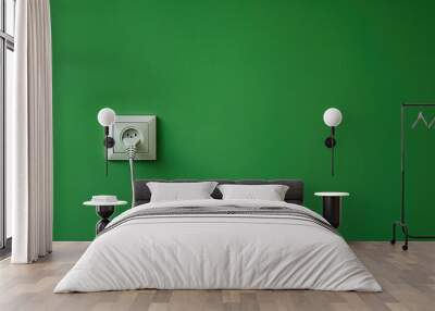 Electric Outlet - White Appliance Mounted on Green Wall for Energy Industry Wall mural