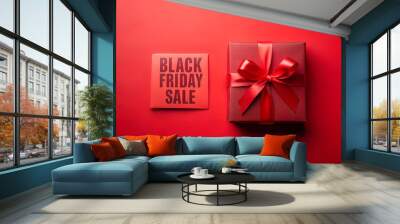 Red gift box on a red background with the inscription BLACK FRIDAY Sale Wall mural