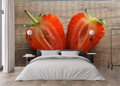 Strawberries on a wooden background, Strawberries are cut into two parts. Wall mural