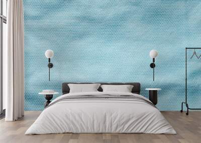 Texture of blue non-woven fabric for sewing disposable protective medical clothing Wall mural