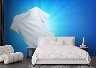 Bright white clean clothes, laundry on blue background Wall mural