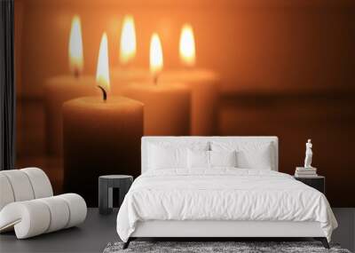 Holiday candles burning on a white background and reflected. Wall mural