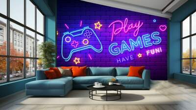 Play Games have fun neon sign with game pad, bright signboard, light banner. Game logo neon, emblem. Vector illustration Wall mural