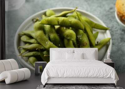 Edamame beans on a white plate Wall mural