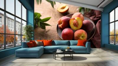 Fresh ripe peaches in a bowl Wall mural