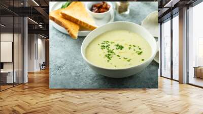 Homemade creamy asparagus soup in a white bowl Wall mural