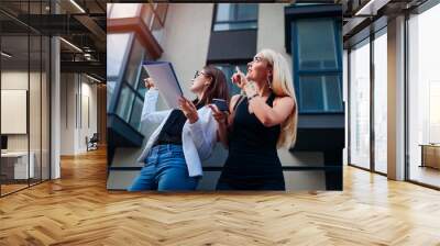 Real estate agent presenting new apartment to client. Businesswoman shows building to customer Wall mural