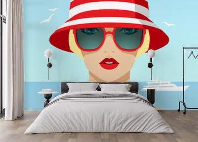 1307_Blonde woman wearing red sunglasses and hat Wall mural