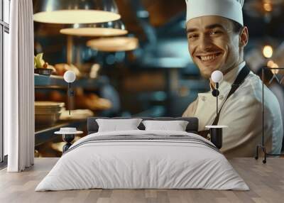 Male chef wearing an apron standing in restaurant kitchen Wall mural