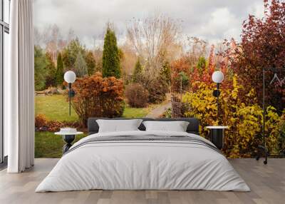 late autumn private garden view with stone pathway and dried hydrangea Wall mural