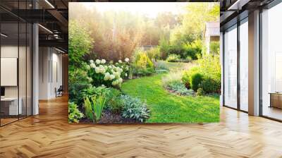 summer private garden with blooming Hydrangea Annabelle. Curvy lawn edge, beautiful pathway. Landscape design in English cottage style. Wall mural