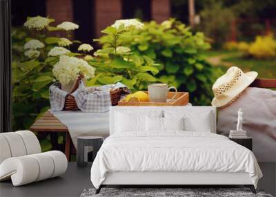 tea with lemon in morning summer garden with blooming hydrangea on background Wall mural