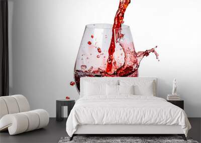 A vivid splash of red wine in a glass against a white background, capturing dynamic motion and contrasting colors, perfect for beverage and celebration themes. Wall mural