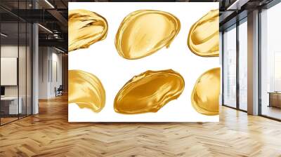 Artistic brushstrokes of gold paint isolated on a white background. Gold paint texture. Wall mural