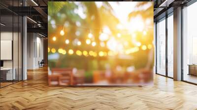 Outdoor evening scene with glowing string lights, candles, and tropical trees, creating a romantic and festive ambiance at a summer event. Wall mural