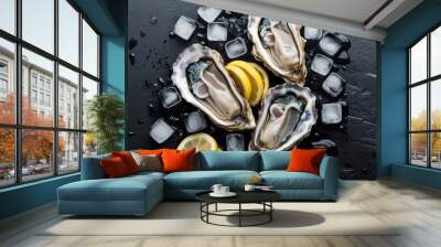 Oysters on ice with lemon slices and herbs on a dark slate background. Wall mural