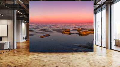 Spiaggia, mare al tramonto con cielo rosso. Sea, beach at sunset with red sky Wall mural