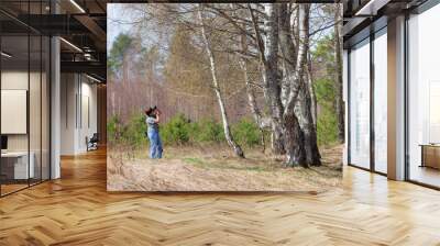 woman photographing nature Wall mural