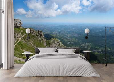 path that leads to the great horn of the mountain area of the gran sasso d'italia with a view of the marine coast of teramo Wall mural