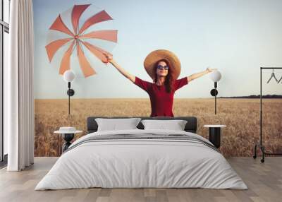 Girl in red dress with umbrella and hat Wall mural