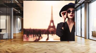 Girl with sunglasses and Parisian background Wall mural