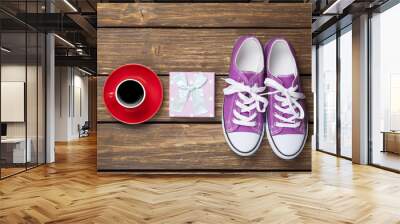 Gumshoes and gift box with coffee cup Wall mural