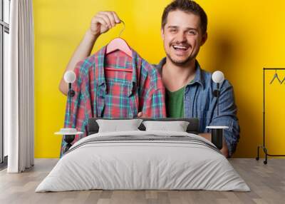 guy with hanger and shirt Wall mural