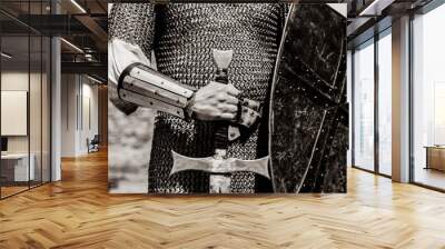 Knight man holding sword and shield. Image in black and white color style Wall mural