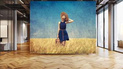 Lonely girl with suitcase at country. Photo in old color image s Wall mural