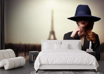 Style women in hat and parisian background Wall mural