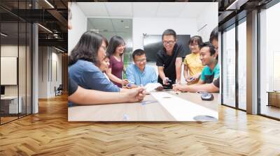 Asian business people group meeting room collaboration colleagues discussing conference desk Wall mural