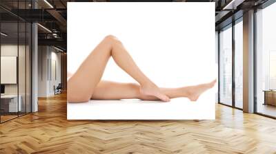 beautiful female legs barefoot lying on white background Wall mural