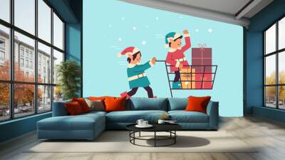 elves preparing for new year and christmas holidays celebration santa helpers pushing trolley cart with gifts Wall mural