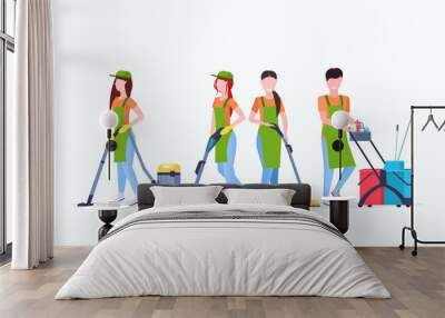 janitors team cleaning service concept male female cleaners in uniform working together with professional equipment flat full length horizontal Wall mural