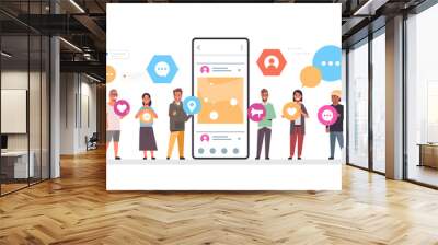 people group holding different types of communication icons mix race men women standing together near smrtphone screen online mobile app social network concept full length horizontal vector Wall mural