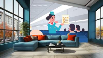 stewardess explaining for passengers instructions card female flight attendants safety demonstration concept modern airplane board interior horizontal portrait vector illustration Wall mural