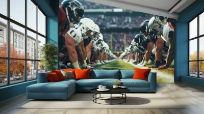 American football teams face off at the line of scrimmage, players in full gear with intense focus on stadium. Ready to start the game Wall mural