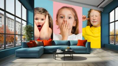 Art collage made of portraits of little and happy kids isolated on multicolored studio background. Human emotions, facial expression concept Wall mural