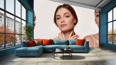 Beautiful, young women with healthy, well-kept skin against grey background. Facebuilding. Aging. Collage. Concept of natural beauty, plastic surgery, cosmetology, cosmetics, skin care Wall mural