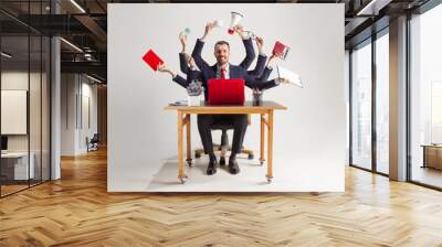 businessman with many hands in elegant suit working and holding office tools. Isolated over white background. Concept of busy Wall mural